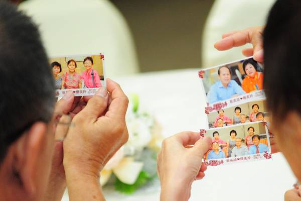 Instant Prints Singapore - Photocards in hands